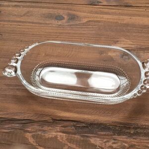 Glass catch all dish.  Beaded border.